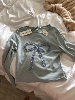 PrettyGarbage Light Blue Ribbed Sweater with Bow Detail